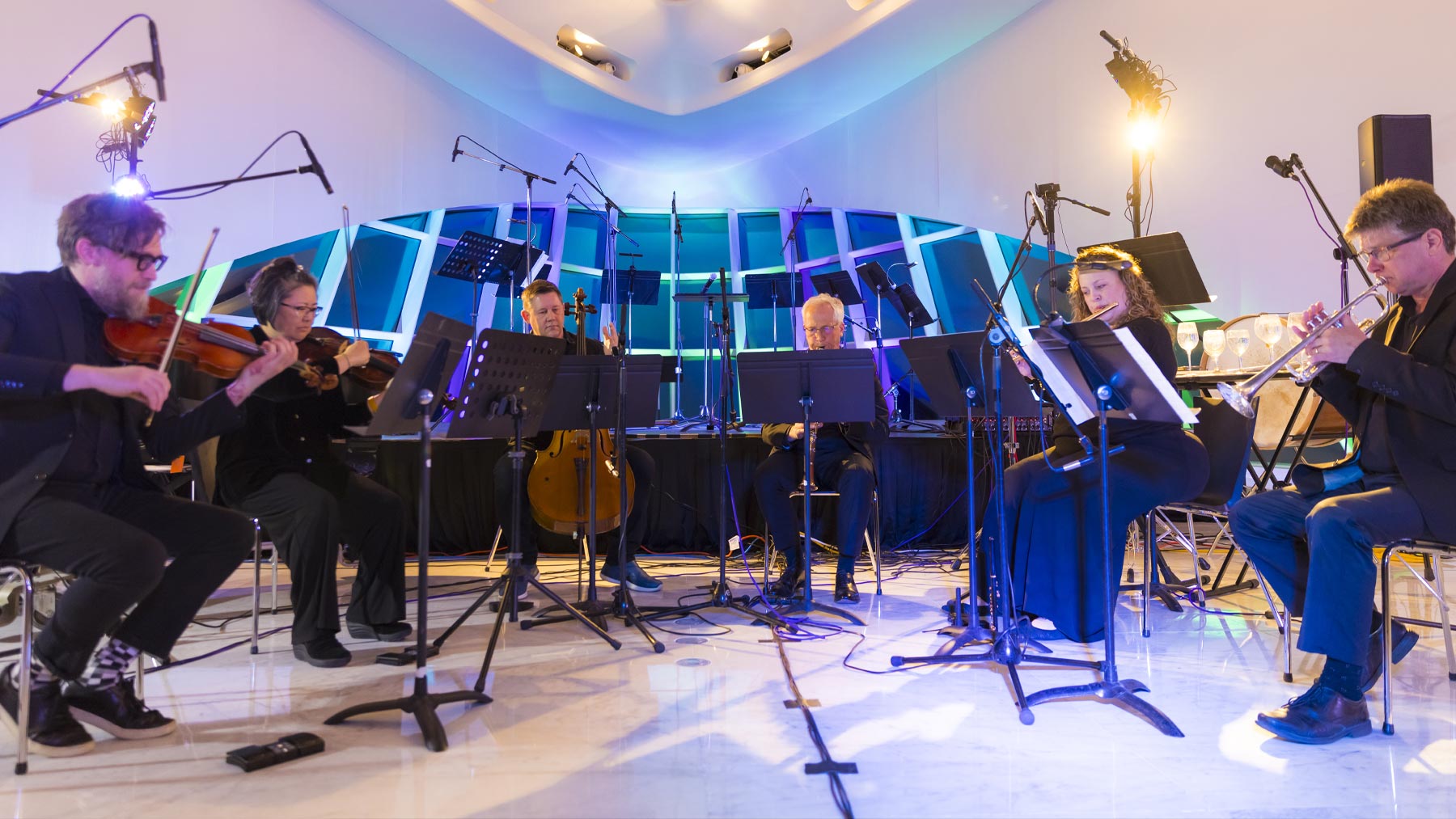 Small group of performers in Windhover Hall