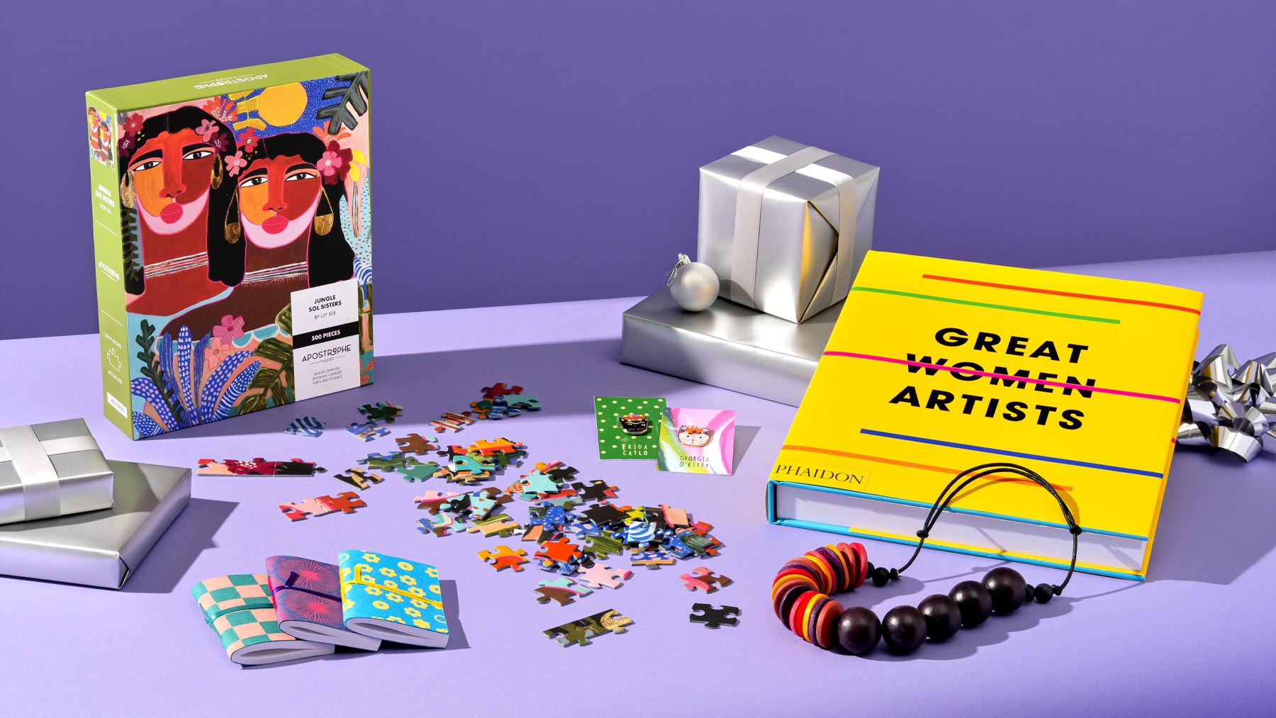 Collection of store items including a puzzle and book on women artists