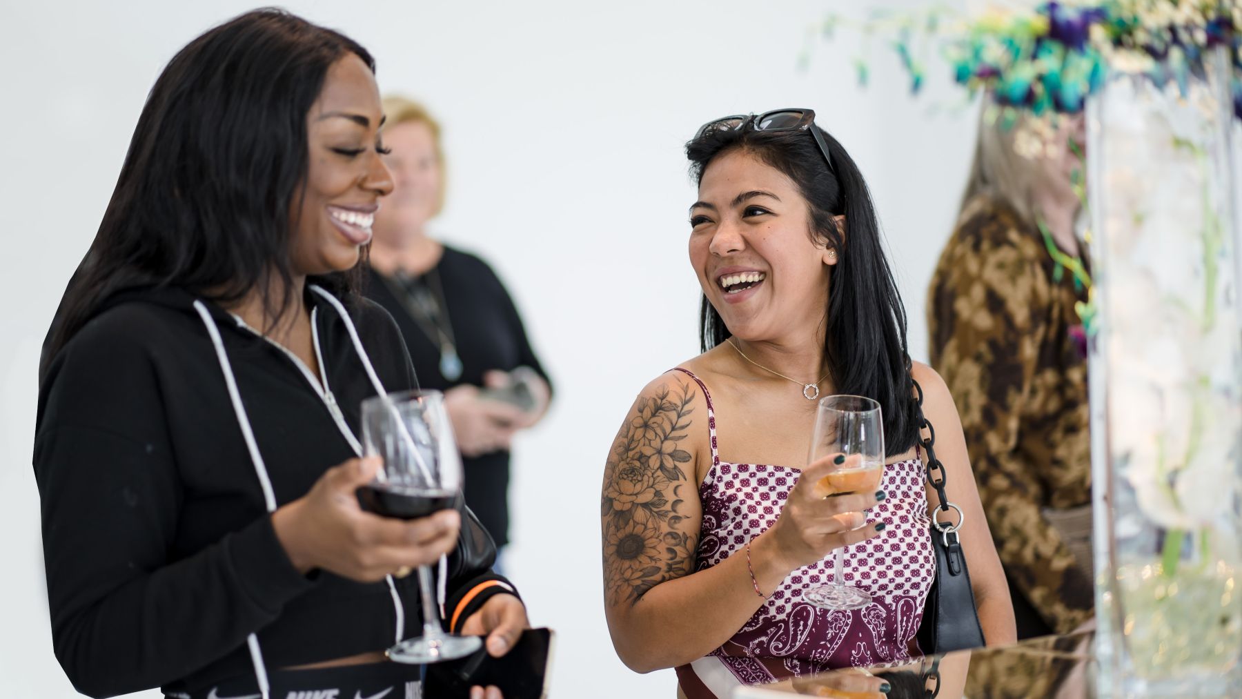 Two women drinking wine