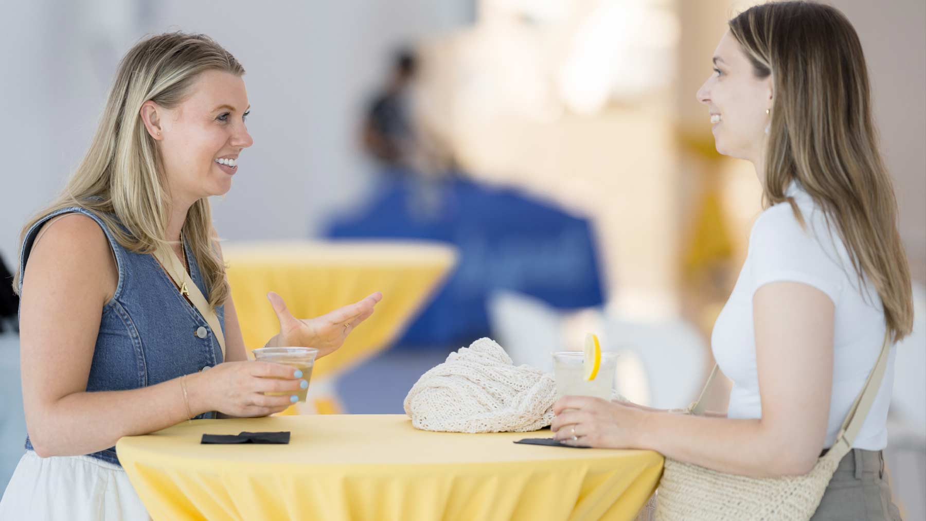 Two women talking at a table