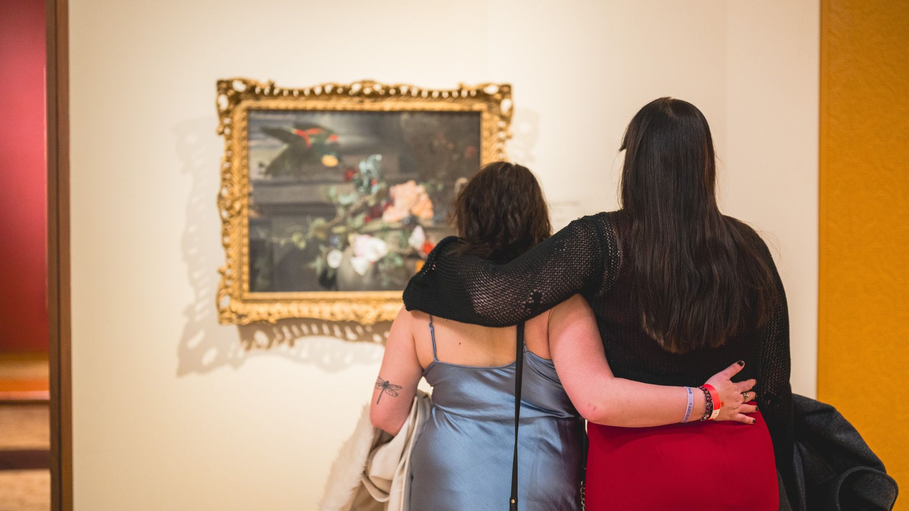 Visitors embracing in the European art galleries