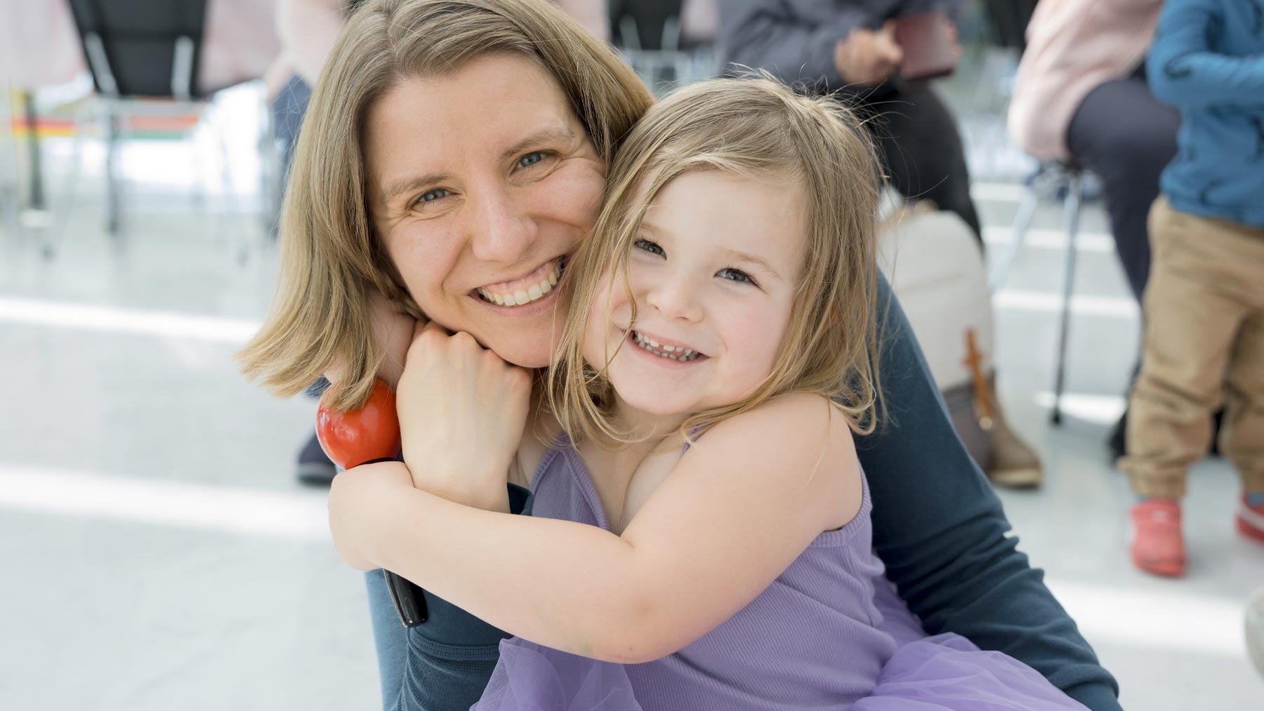 Woman hugging a young girl