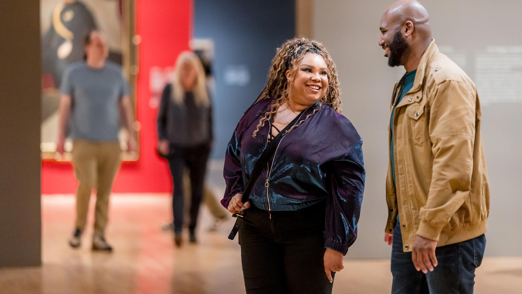 Man and woman talking in the galleries