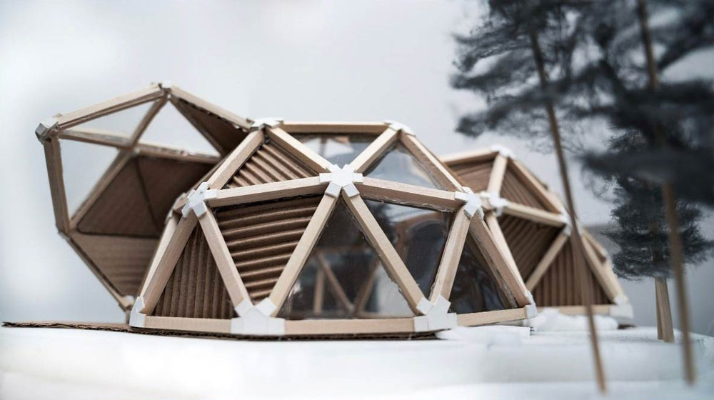 Dome style huse model covered in windows made of cardboard and other materials
