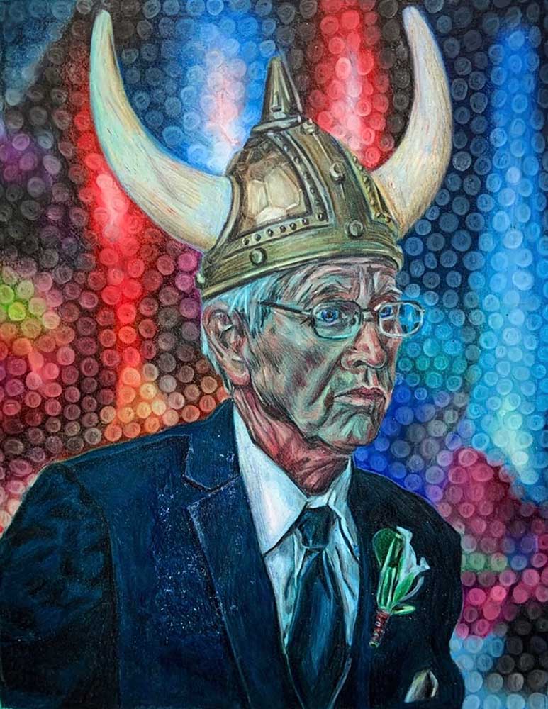 Edlerly man with glasses in a blue suite wearing a viking helmet with a rainbow of lights in the background