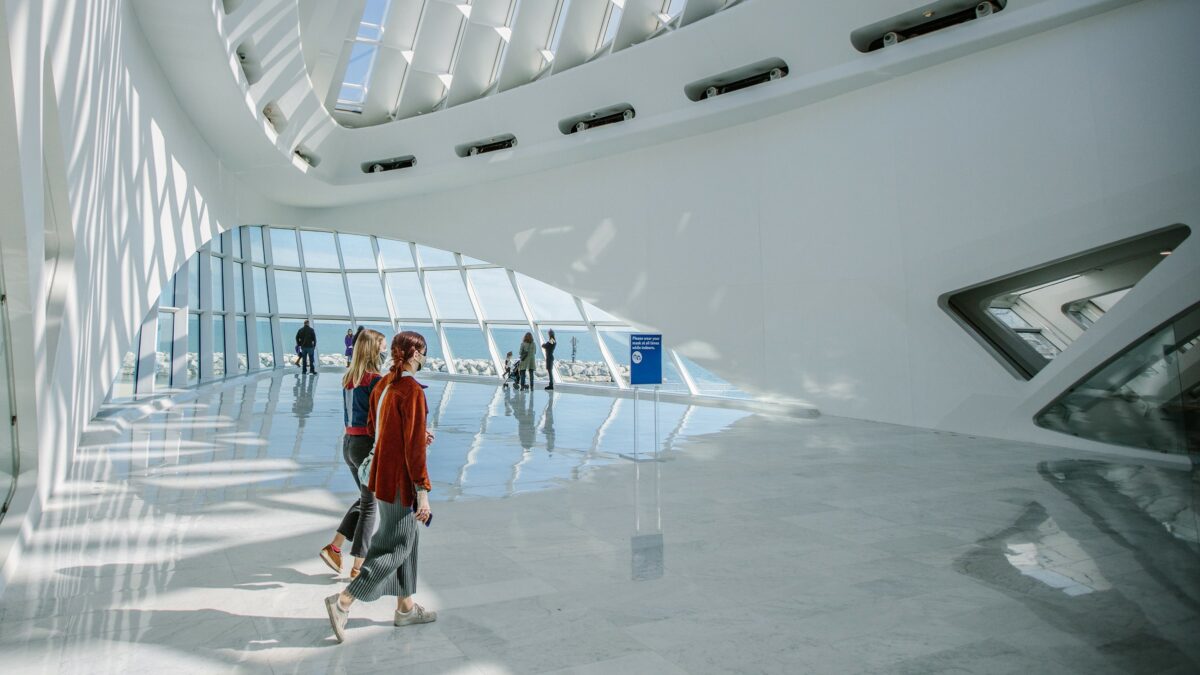 Two people walking in Windhover Hall