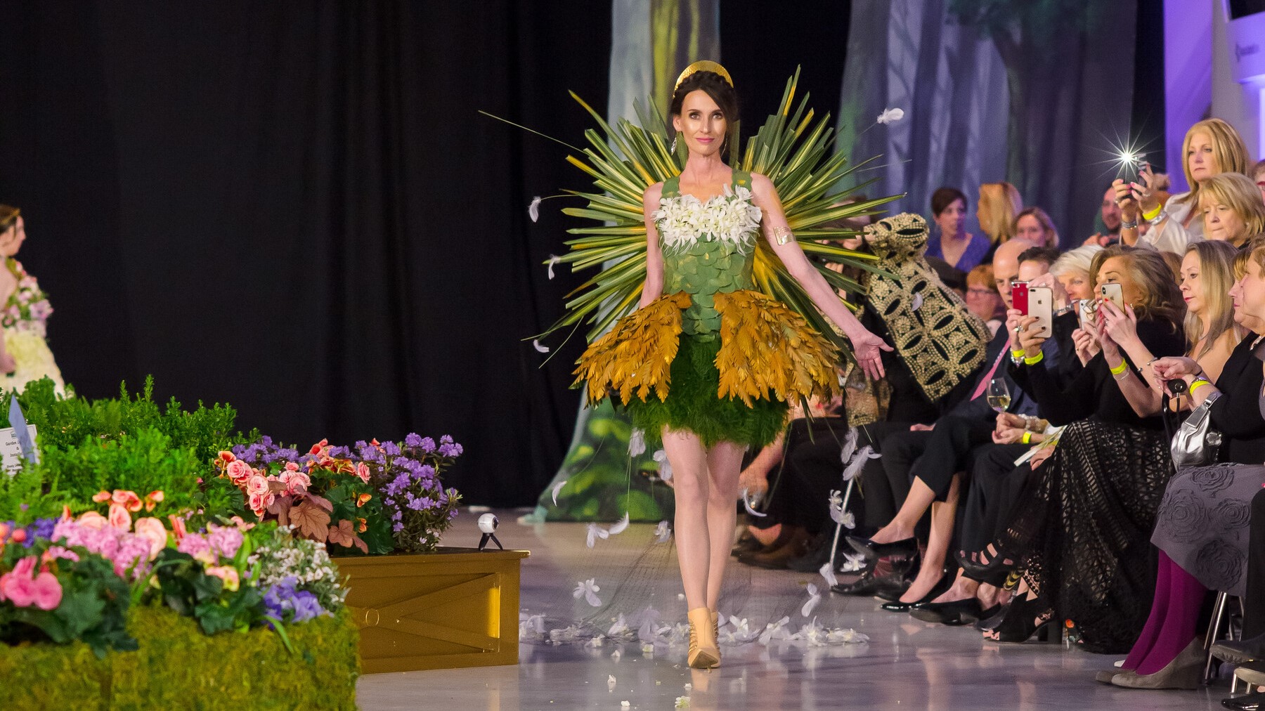Model walks the runway at a floral fashion show