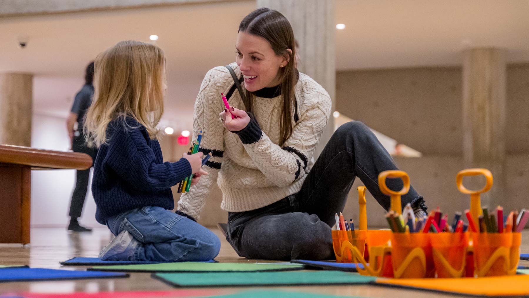 Young woman and child creating art