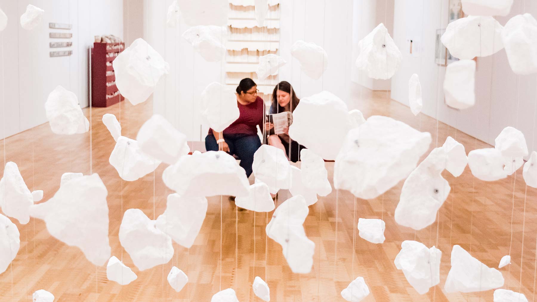 Two women sitting in the Museum