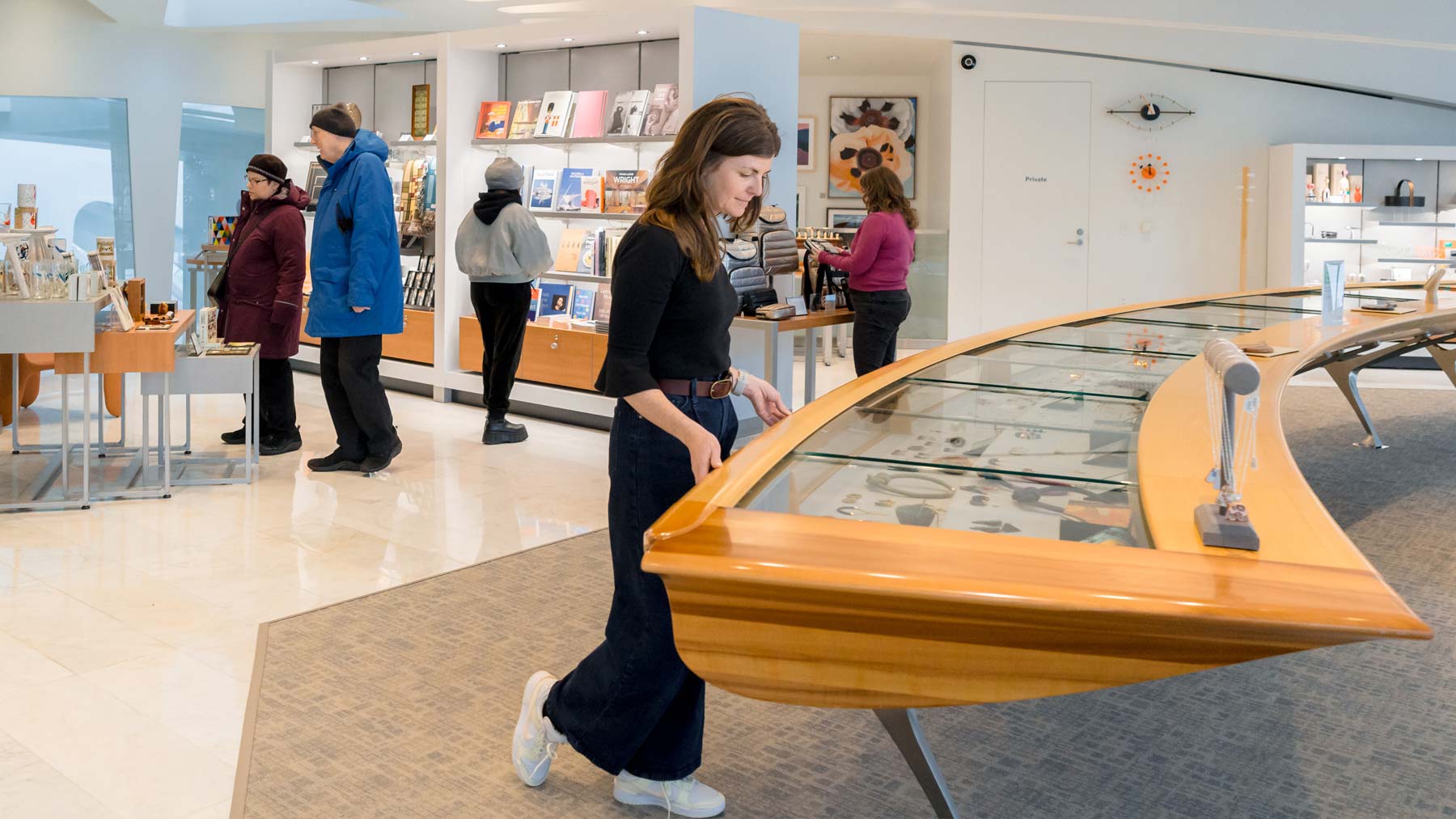 Woman browsing items at the Museum Store