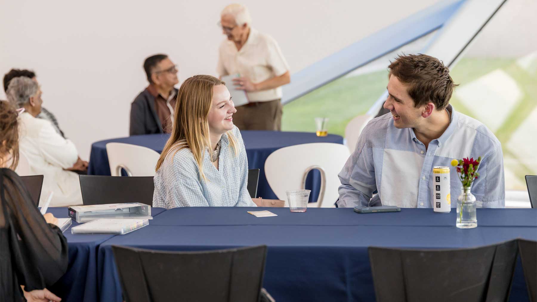 Man and woman sitting at a table chatting