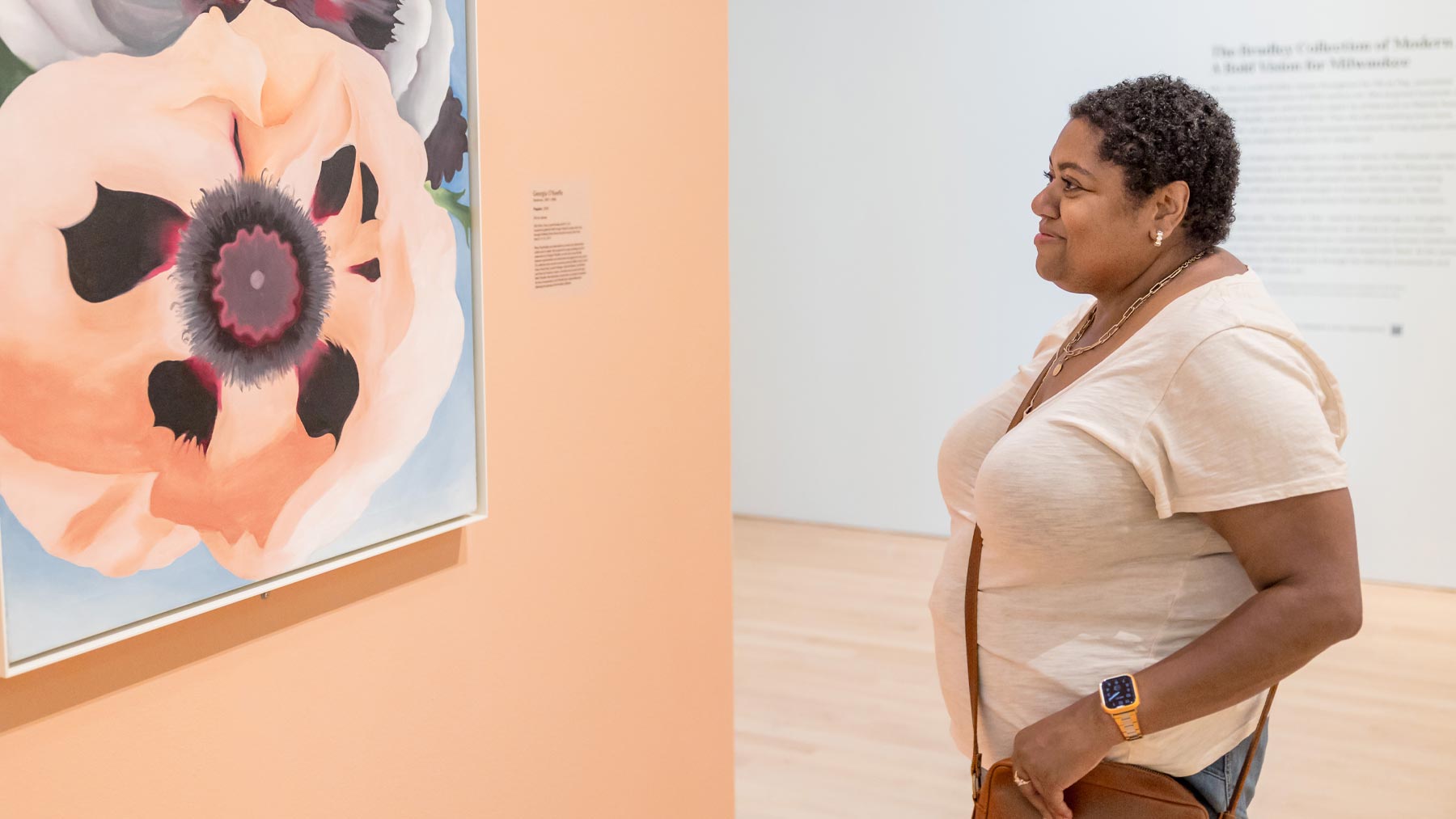 Woman looking at a work of art from O'Keefe