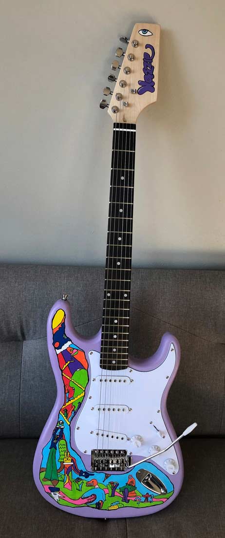 Electric guitar painted over with bright colors of an alien landscape