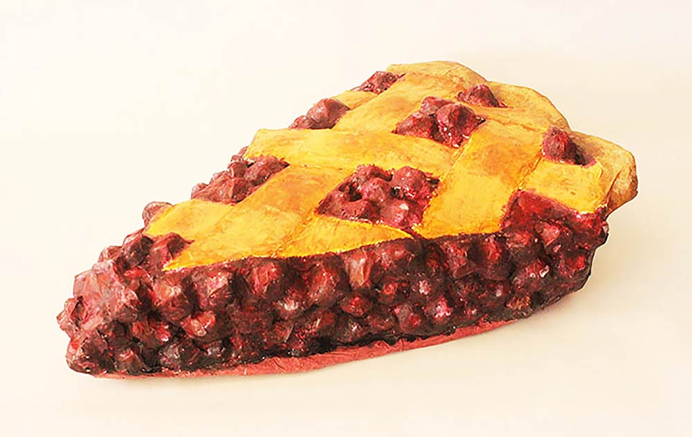 Piece of cherry pie with lattice crust