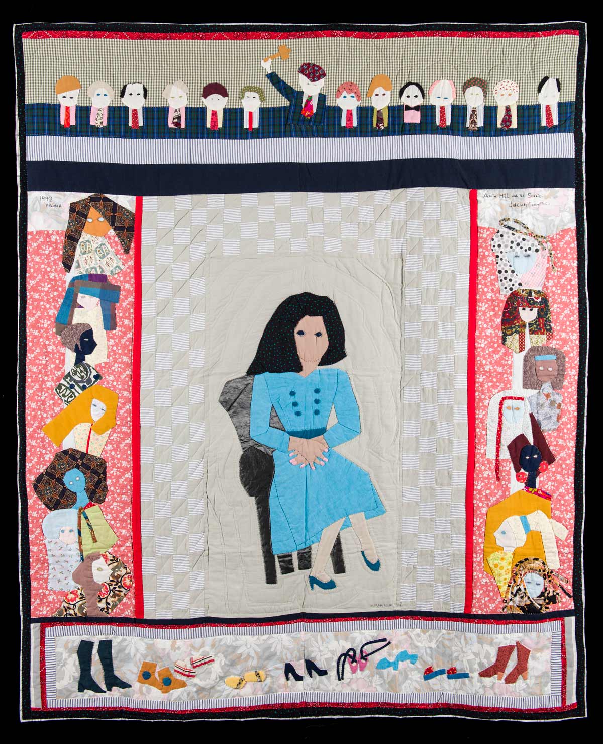 Quilt of a woman sitting in a chair in the middle with different people along the outside as an audience